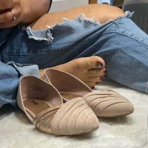 Well worn pink flats